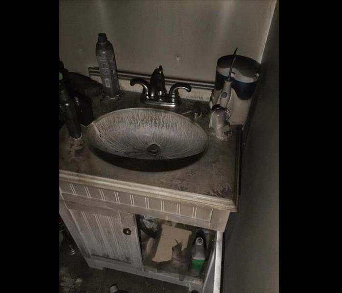 Kitchen sink covered in smoke soot
